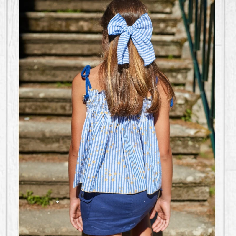 lm-9630-cnjto-falda-azulon-blusa-rayas-tirantes-new-york cconjunto niñafalda azulona yblusa rayas azules tirantes estrellas doradas new york, la martinica verano 2025